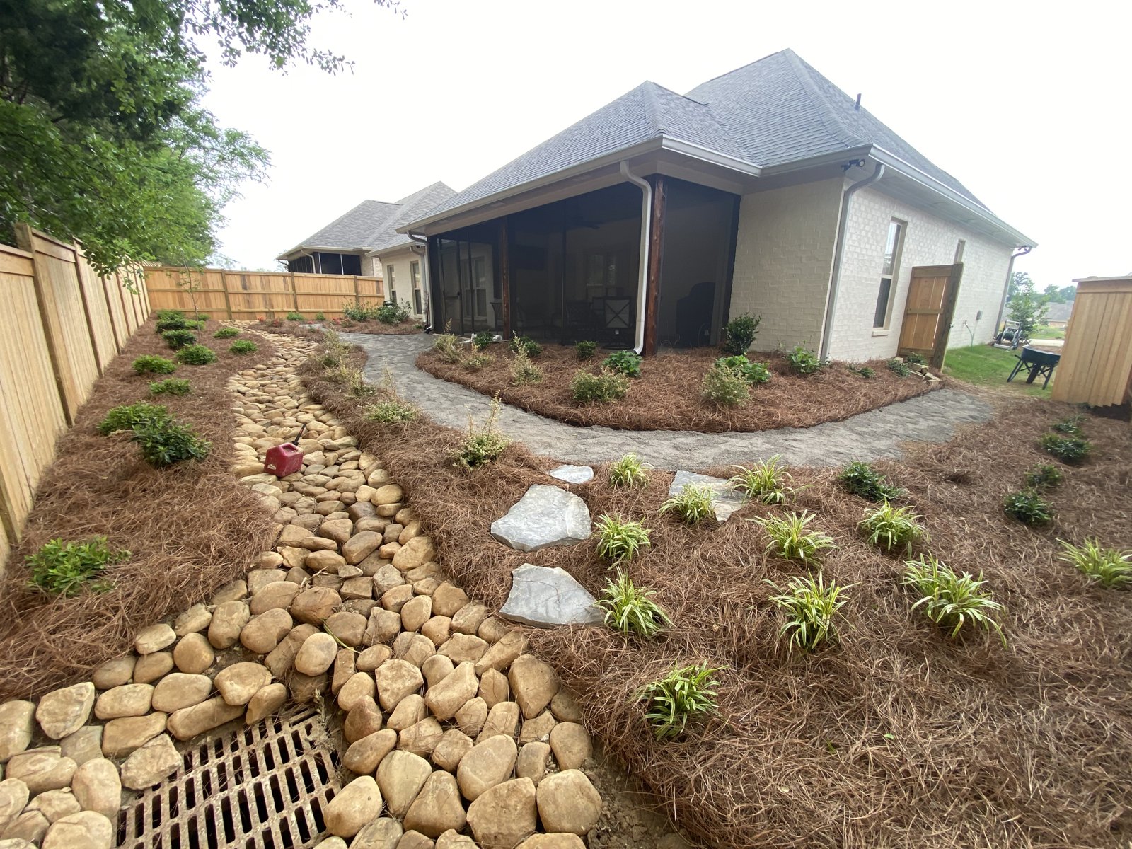 River-rock dry creek and accent plantings